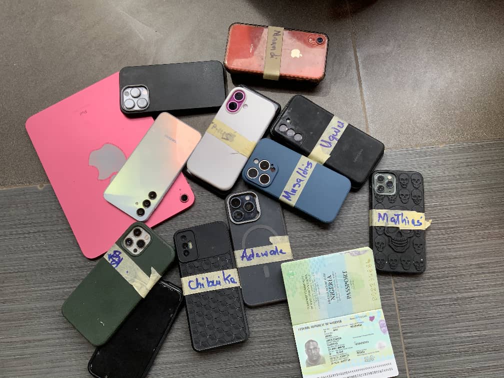a group of cell phones and a passport